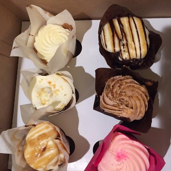 Fat Bottomed Girl's Cupcakes signature dishes Ooey Gooey Butter Cake
Strawberry Cheesecake Ice Cream
Peanut Butter Cup Cake